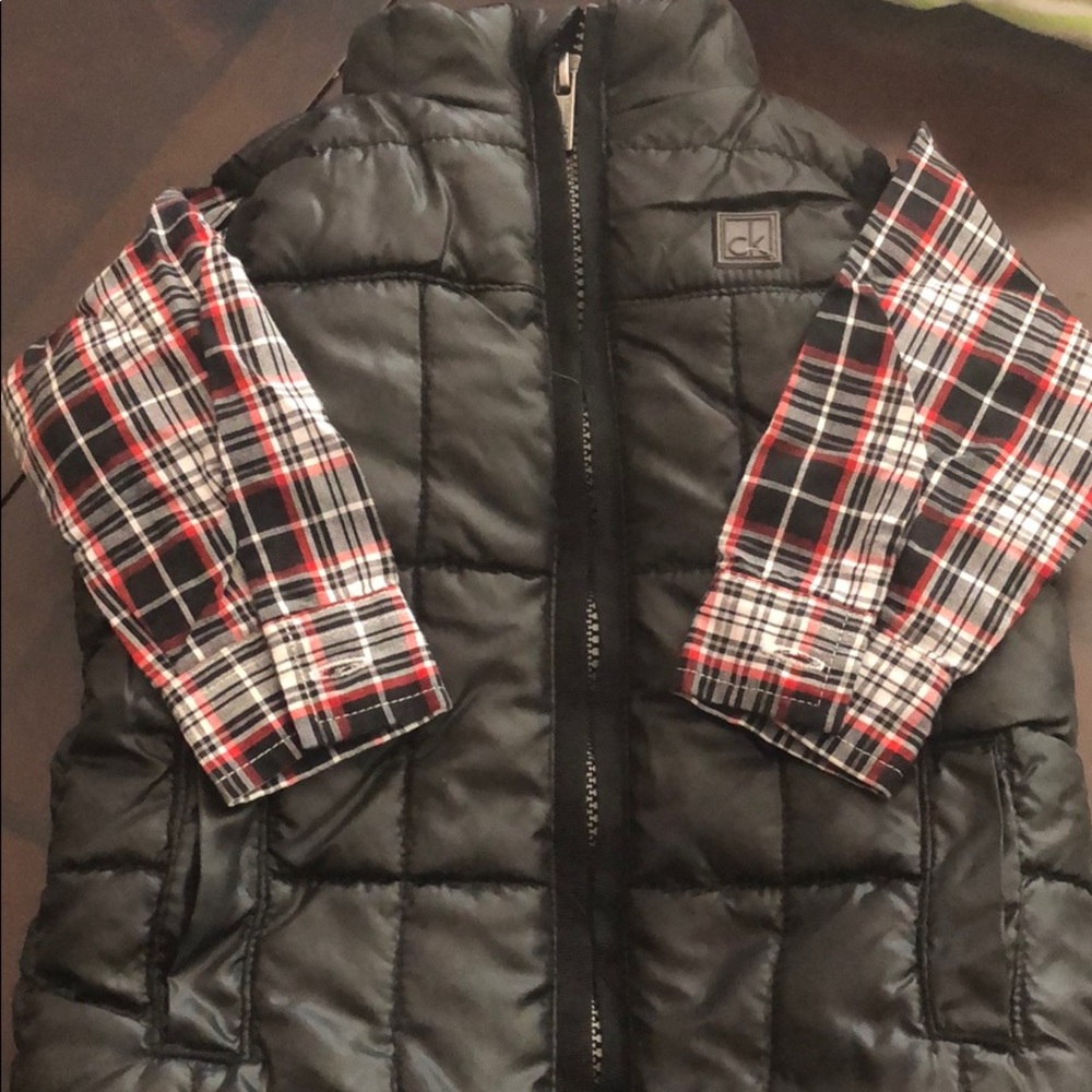 Calvin Klein dress shirt and black vest.